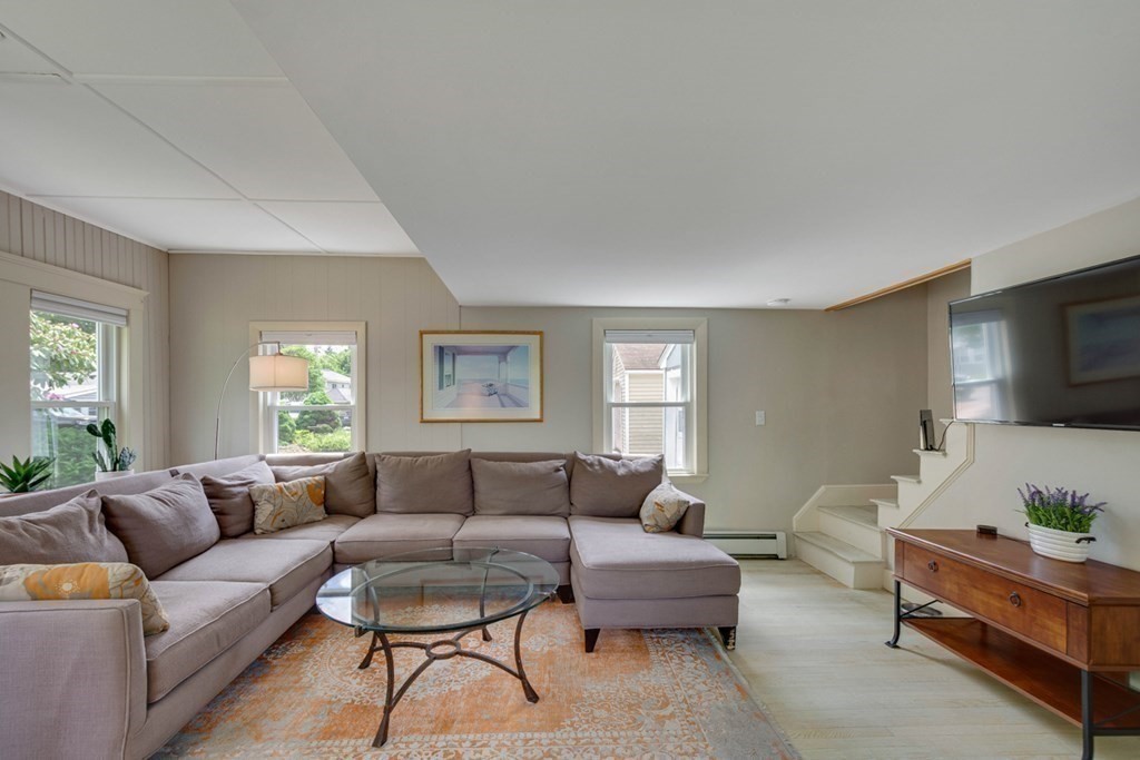16 Milford Avenue Natick, MA 01760 - Photo 11 of 34 a living room with furniture and a flat screen tv