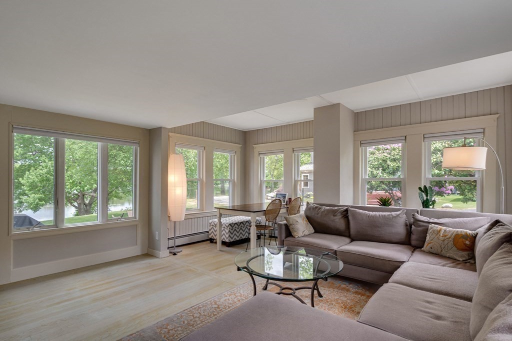 16 Milford Avenue Natick, MA 01760 - Photo 12 of 34 a living room with furniture and a large window