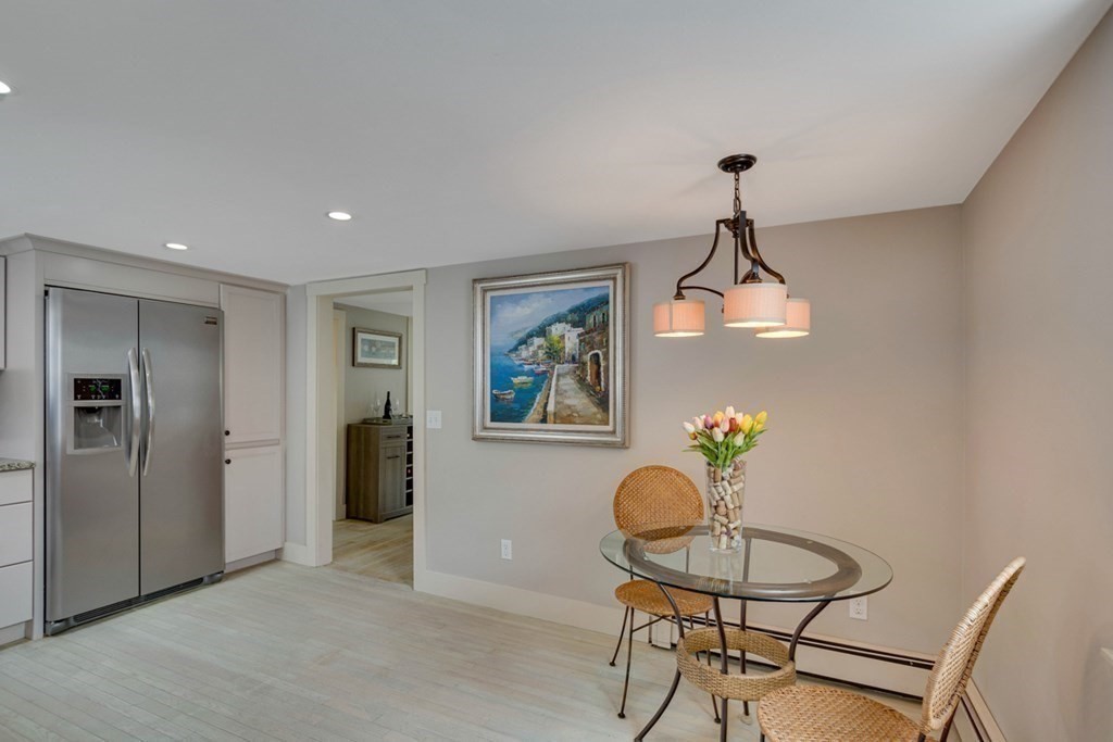 16 Milford Avenue Natick, MA 01760 - Photo 17 of 34 a view of a livingroom with furniture and a chandelier