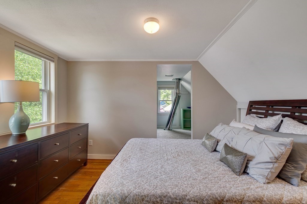 16 Milford Avenue Natick, MA 01760 - Photo 21 of 34 a bedroom with a bed and a dresser