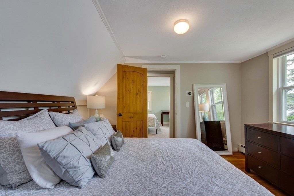 16 Milford Avenue Natick, MA 01760 - Photo 22 of 34 a bedroom with a bed and a dresser
