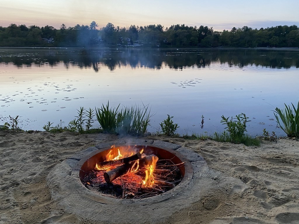 16 Milford Avenue Natick, MA 01760 - Photo 28 of 34 an aerial view of a golf course with wooden fence and lake view