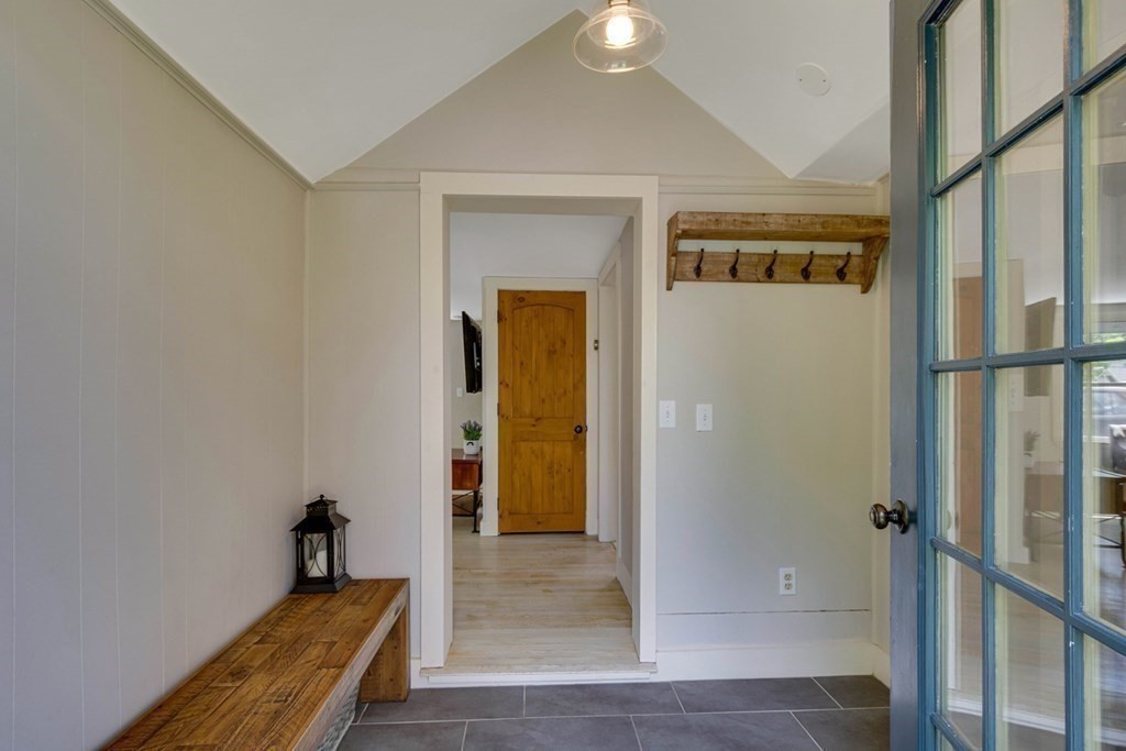 16 Milford Avenue Natick, MA 01760 - Photo 8 of 34 a view of a hallway with wooden floor and entryway