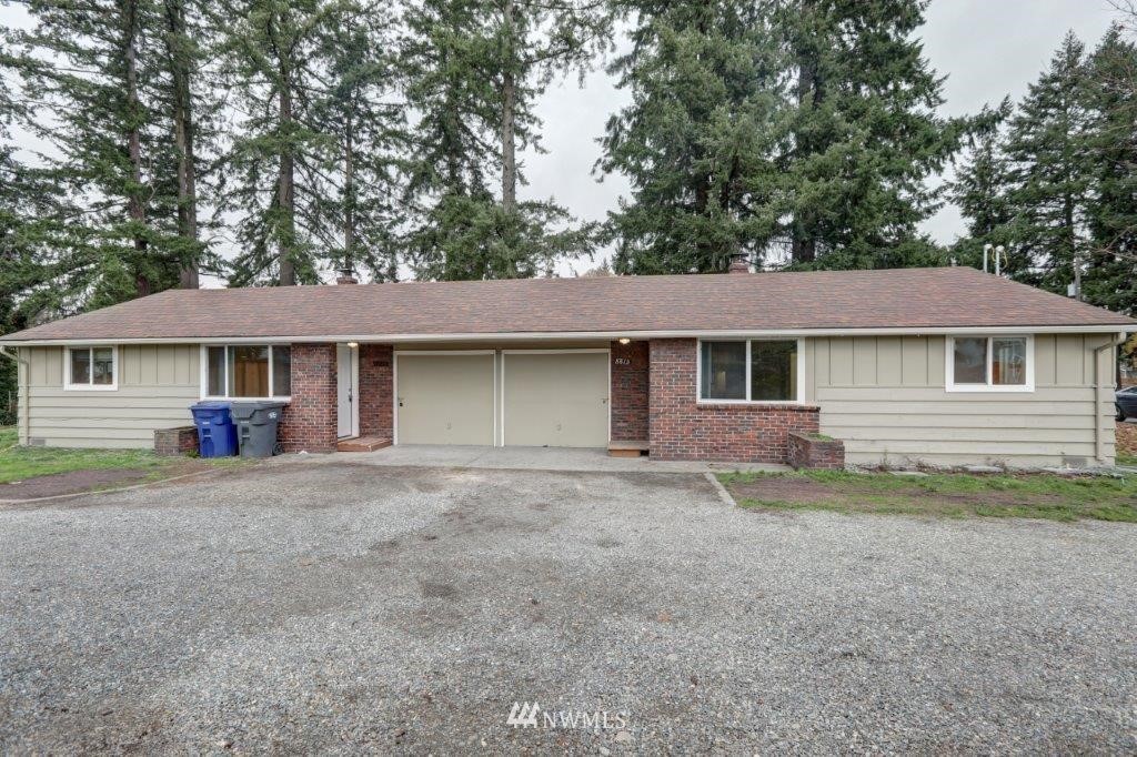 8818 Custer Road Southwest Lakewood, WA 98499 - Photo 6 of 10 front view of a house and a yard