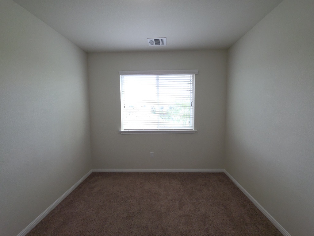 18009 Malnati Drive Pflugerville, TX 78660 - Photo 18 of 22 an empty room with a window