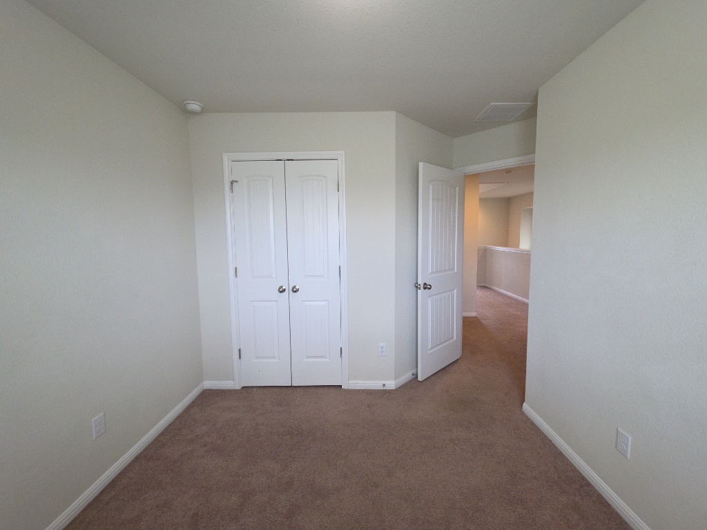 18009 Malnati Drive Pflugerville, TX 78660 - Photo 19 of 22 a view of a room with a hallway
