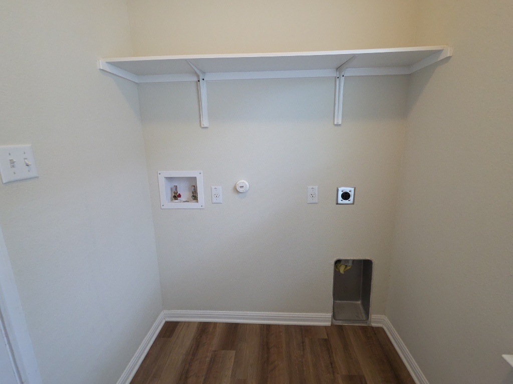 18009 Malnati Drive Pflugerville, TX 78660 - Photo 6 of 22 a view of small space with racks on the wall