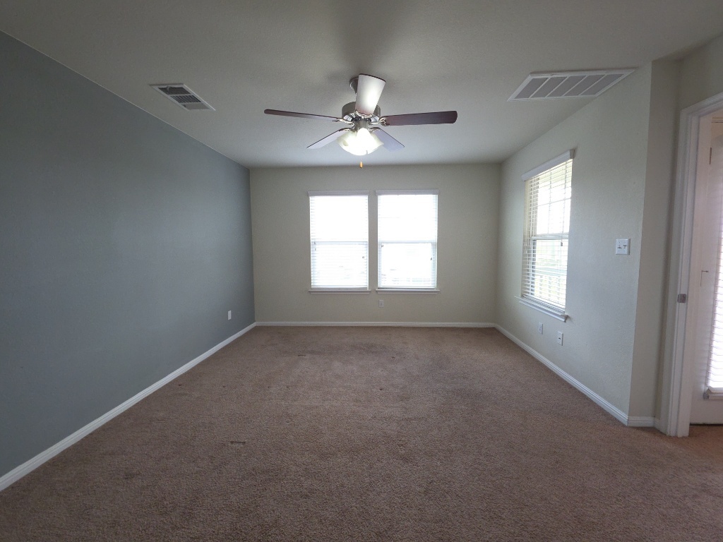 18009 Malnati Drive Pflugerville, TX 78660 - Photo 10 of 22 an empty room that has a window