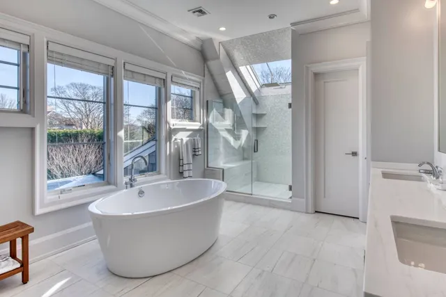 a bathroom with a bathtub and shower