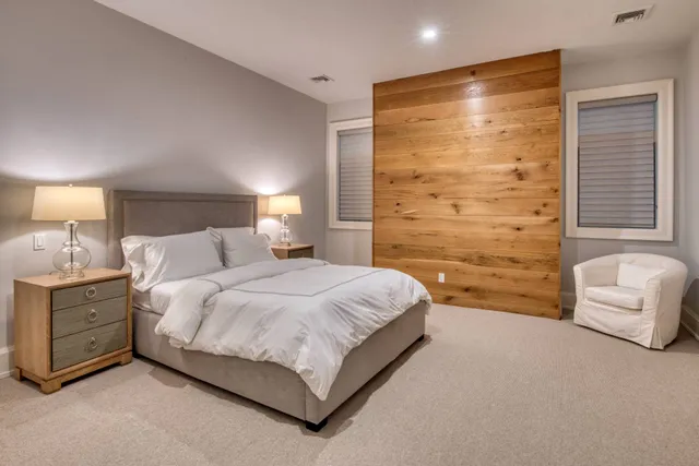 a spacious bedroom with a bed and a couch