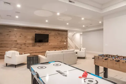 a living room with furniture and flat screen tv