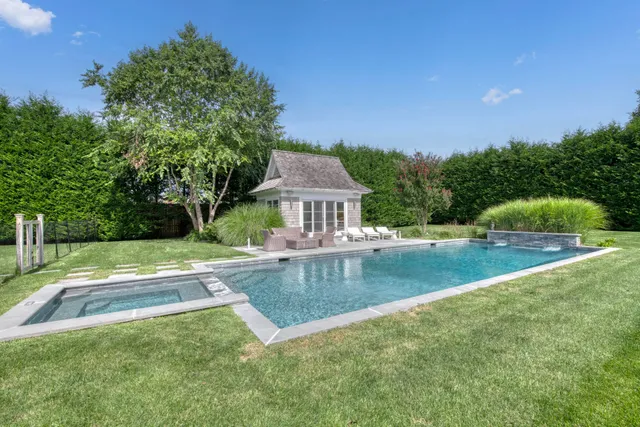 a view of pool with garden