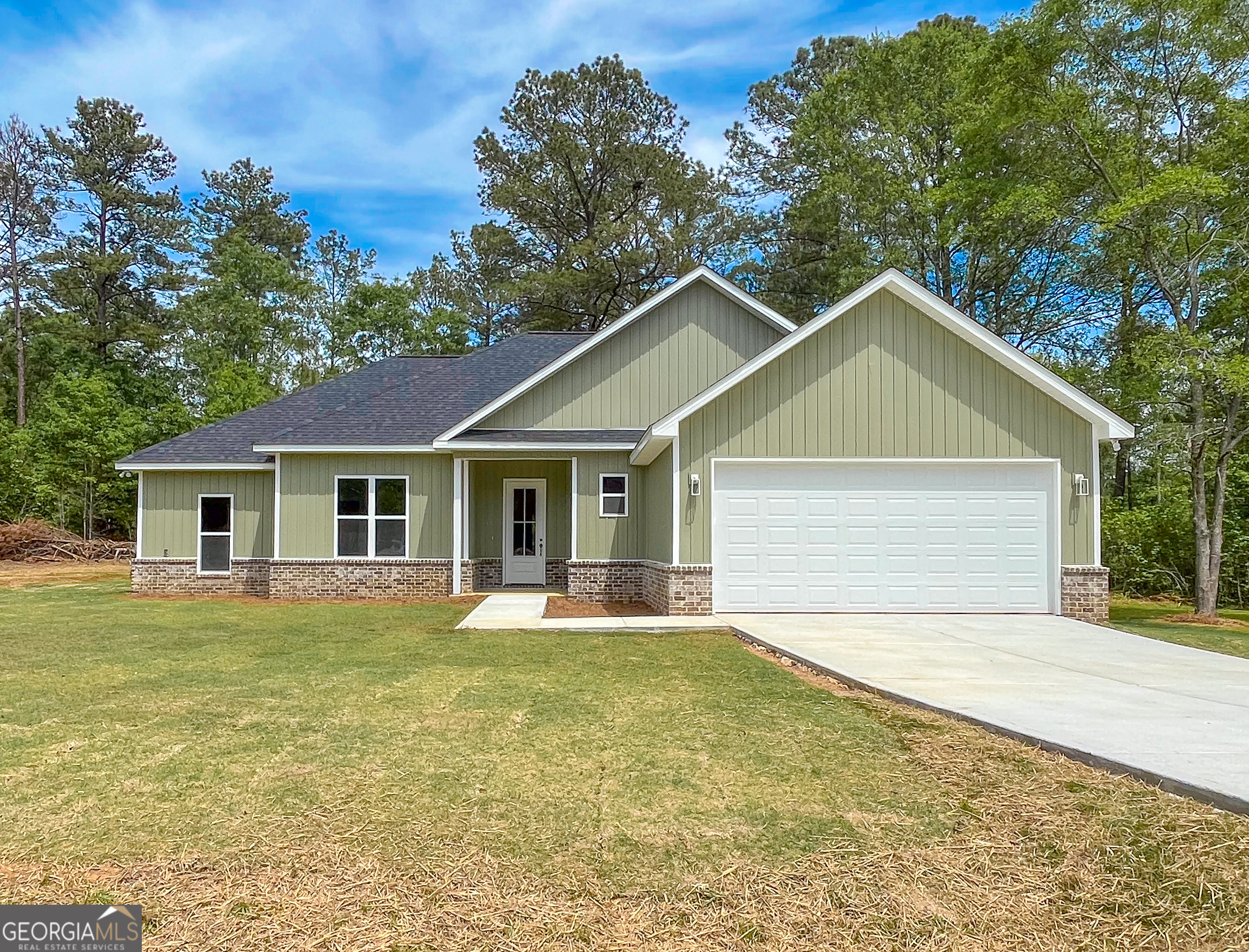 711 Flanders Lane Dublin, GA 31021 - Photo 40 of 49 a front view of a house with a yard and trees