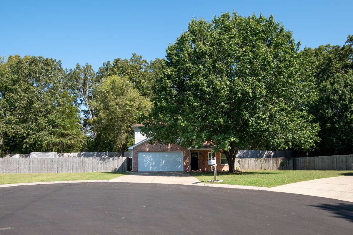 7226 Hidden Lake Drive Fairview, TN 37062 - Photo 1 of 54 a house with trees in the background