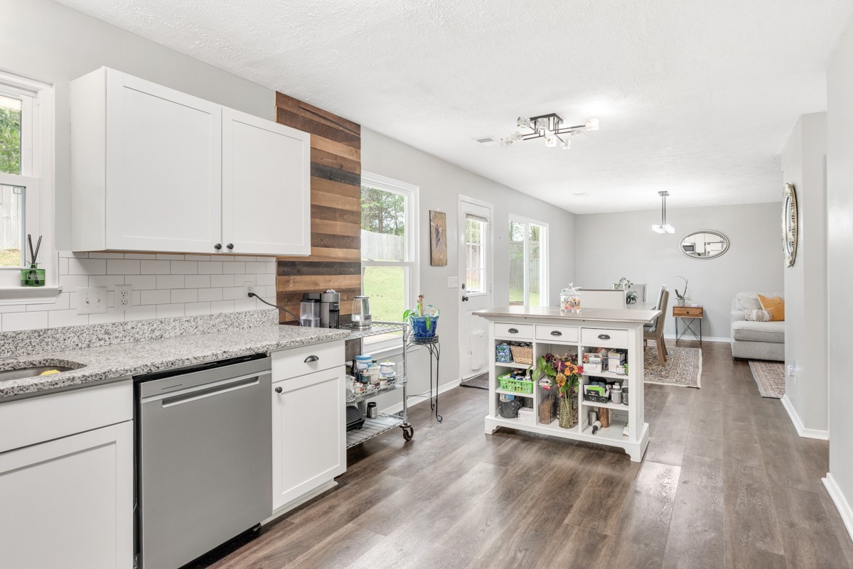 7226 Hidden Lake Drive Fairview, TN 37062 - Photo 17 of 54 a kitchen with a table chairs stove and cabinets