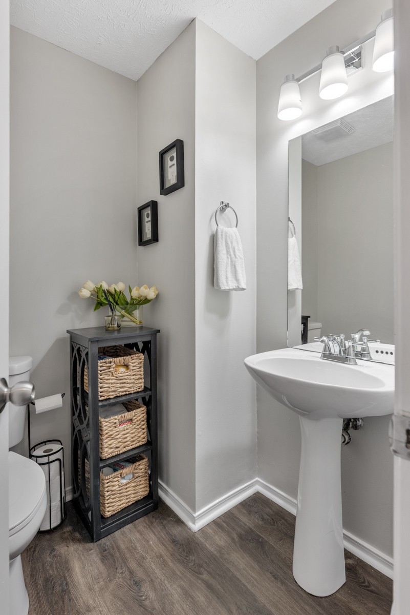 7226 Hidden Lake Drive Fairview, TN 37062 - Photo 20 of 54 a bathroom with a sink toilet and mirror