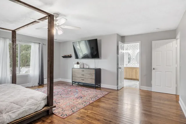 a bedroom with furniture and window