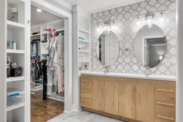 a view of a bathroom with a sink and mirror