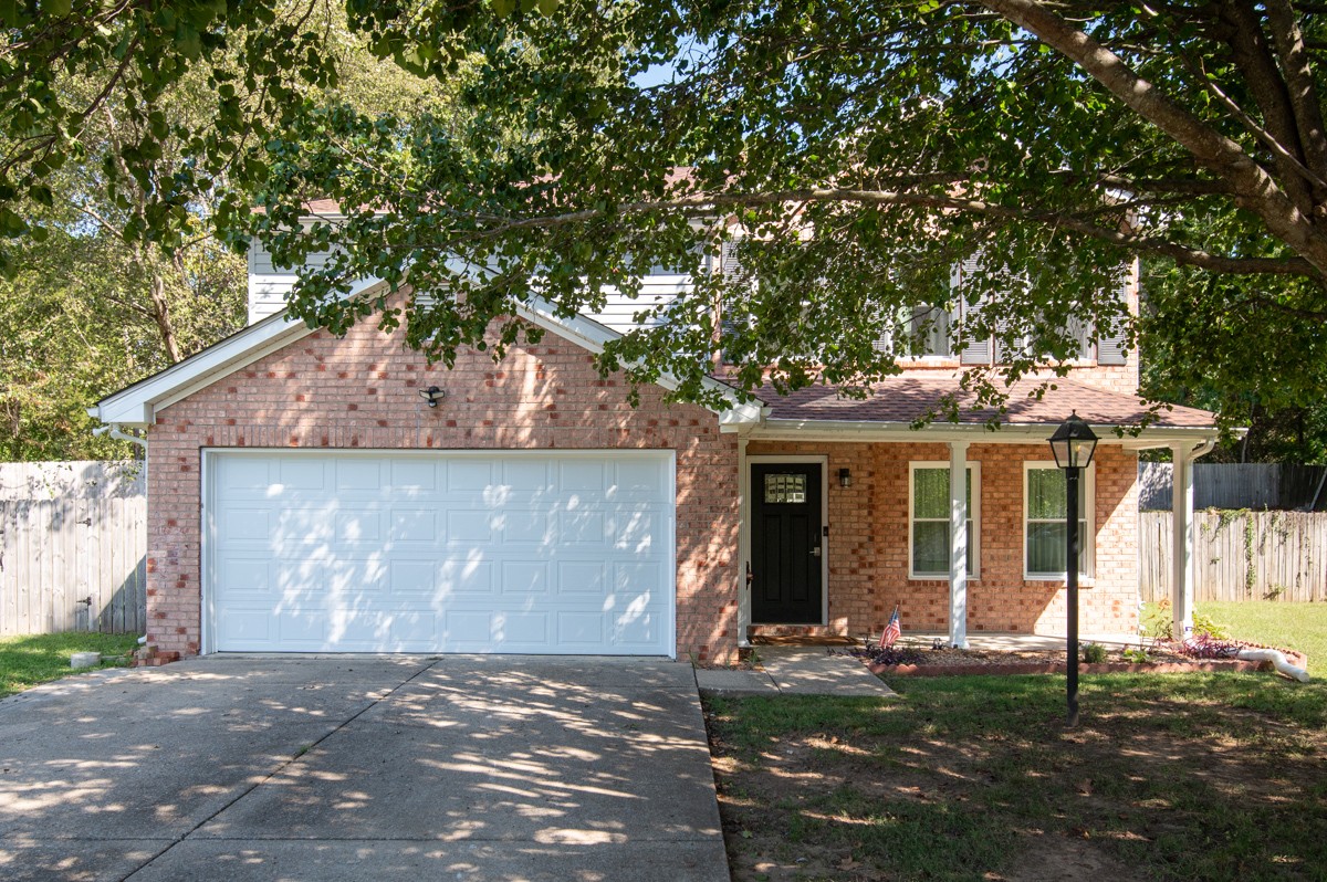 7226 Hidden Lake Drive Fairview, TN 37062 - Photo 3 of 54 a view of a house with a yard