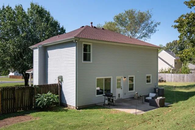 a front view of house with yard and outdoor seating