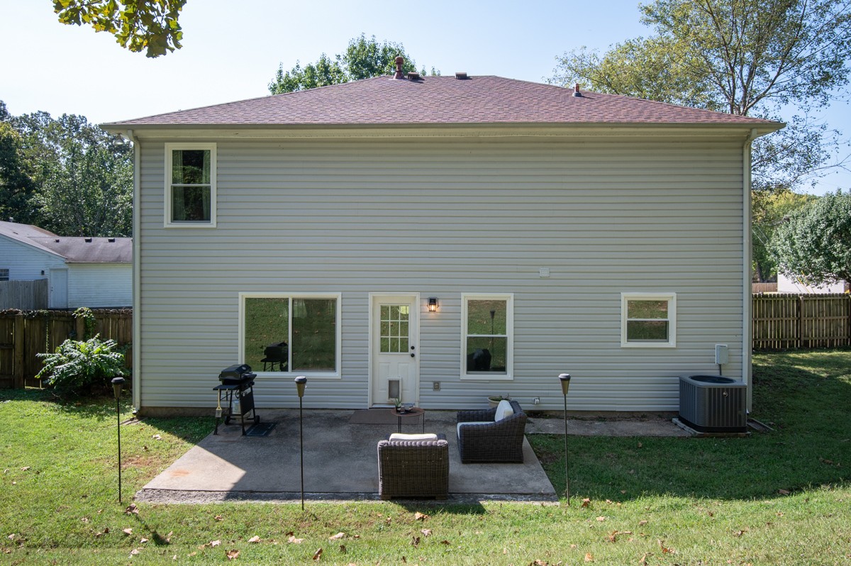 7226 Hidden Lake Drive Fairview, TN 37062 - Photo 36 of 54 a backyard of a house with seating space