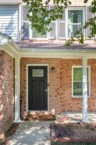a front view of a building with outdoor space