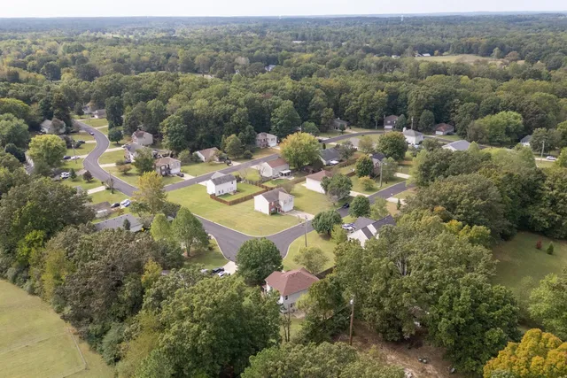 an aerial view of a house with lake view