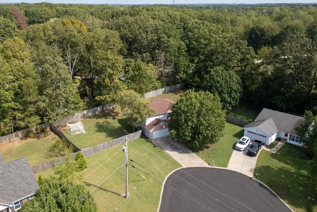 an aerial view of residential house with outdoor space