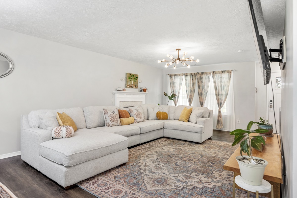 7226 Hidden Lake Drive Fairview, TN 37062 - Photo 8 of 54 a living room with furniture and a chandelier