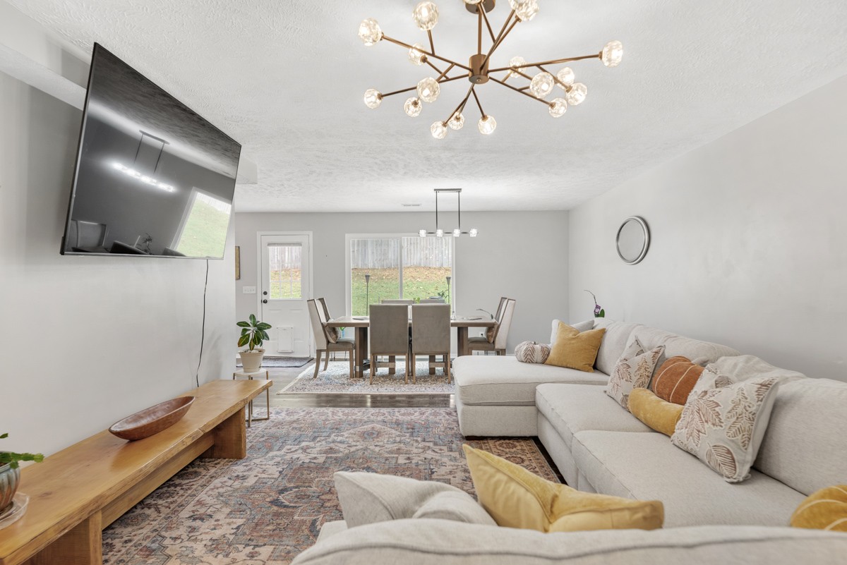 7226 Hidden Lake Drive Fairview, TN 37062 - Photo 9 of 54 a living room with furniture and a flat screen tv