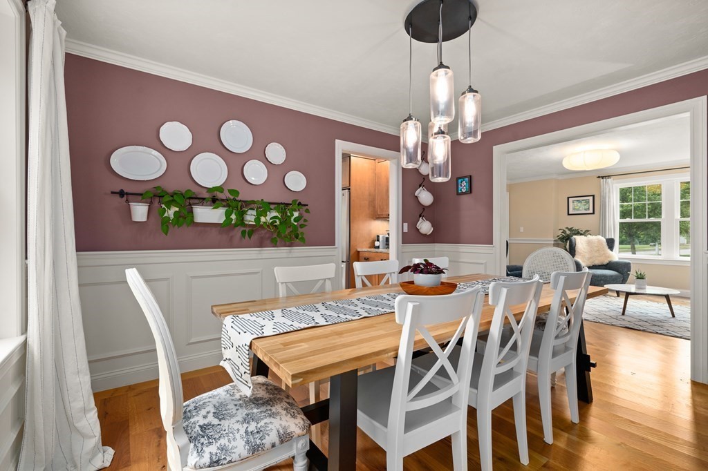 4 Mentas Circle Woburn, MA 01801 - Photo 14 of 41 a view of a dining room with furniture and wooden floor