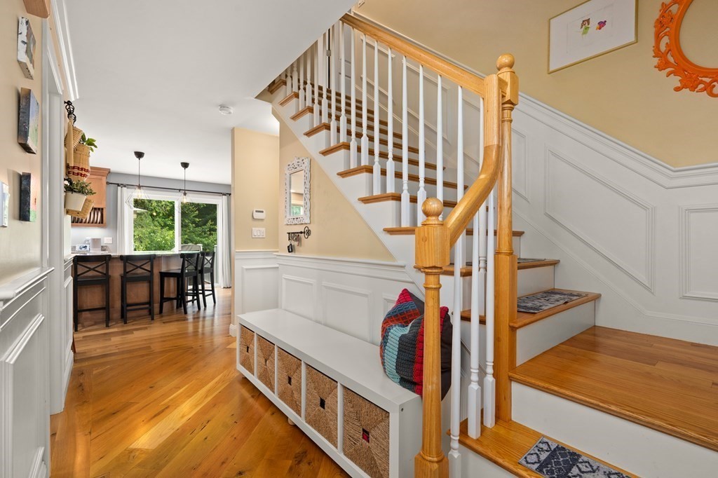 4 Mentas Circle Woburn, MA 01801 - Photo 16 of 41 a view of entryway dining room and hall with wooden floor