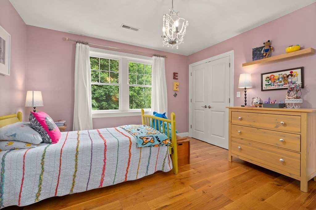 4 Mentas Circle Woburn, MA 01801 - Photo 23 of 41 a bedroom with a bed and a dresser