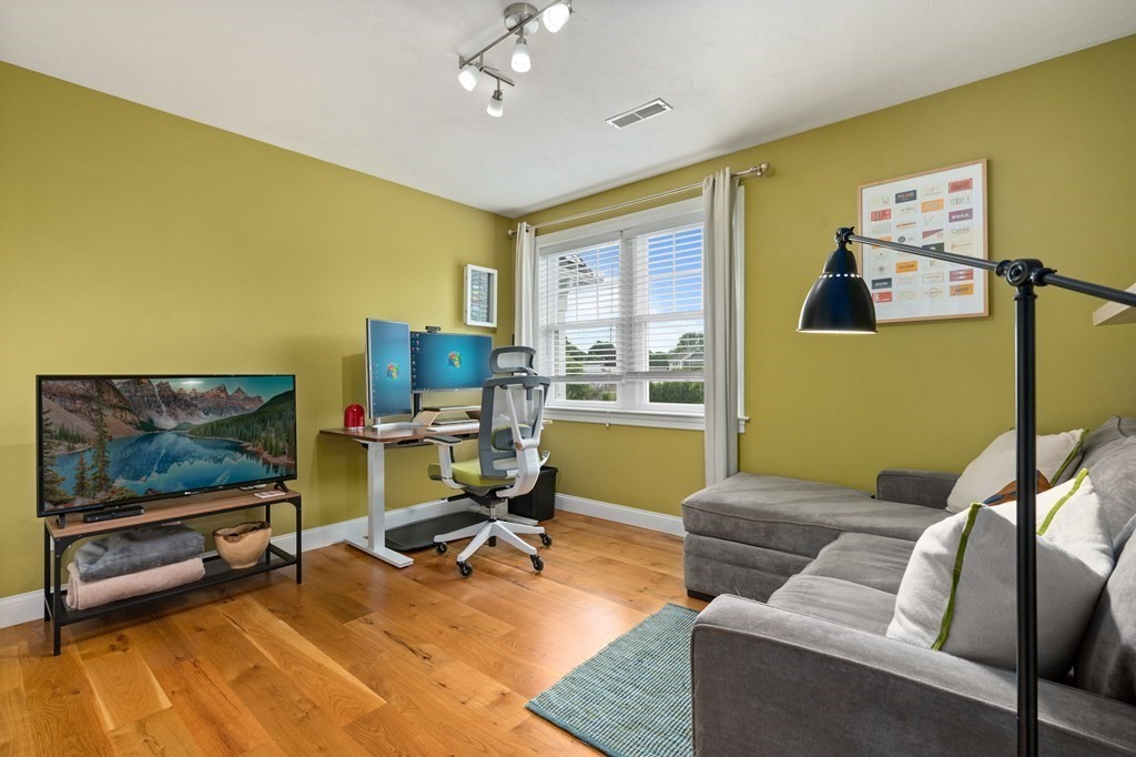 4 Mentas Circle Woburn, MA 01801 - Photo 25 of 41 a living room with furniture and a flat screen tv