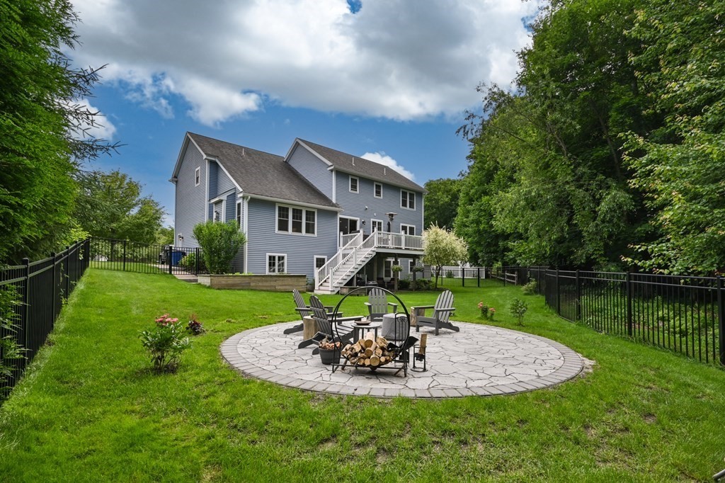 4 Mentas Circle Woburn, MA 01801 - Photo 39 of 41 a view of a house with a yard and potted plants