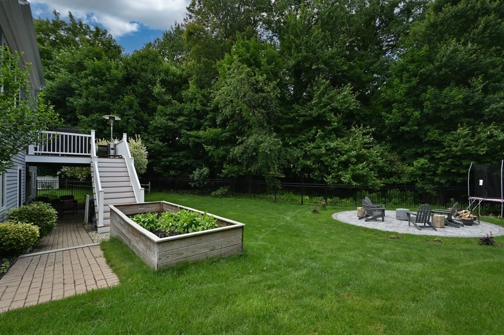 4 Mentas Circle Woburn, MA 01801 - Photo 41 of 41 a view of a backyard with plants and outdoor seating