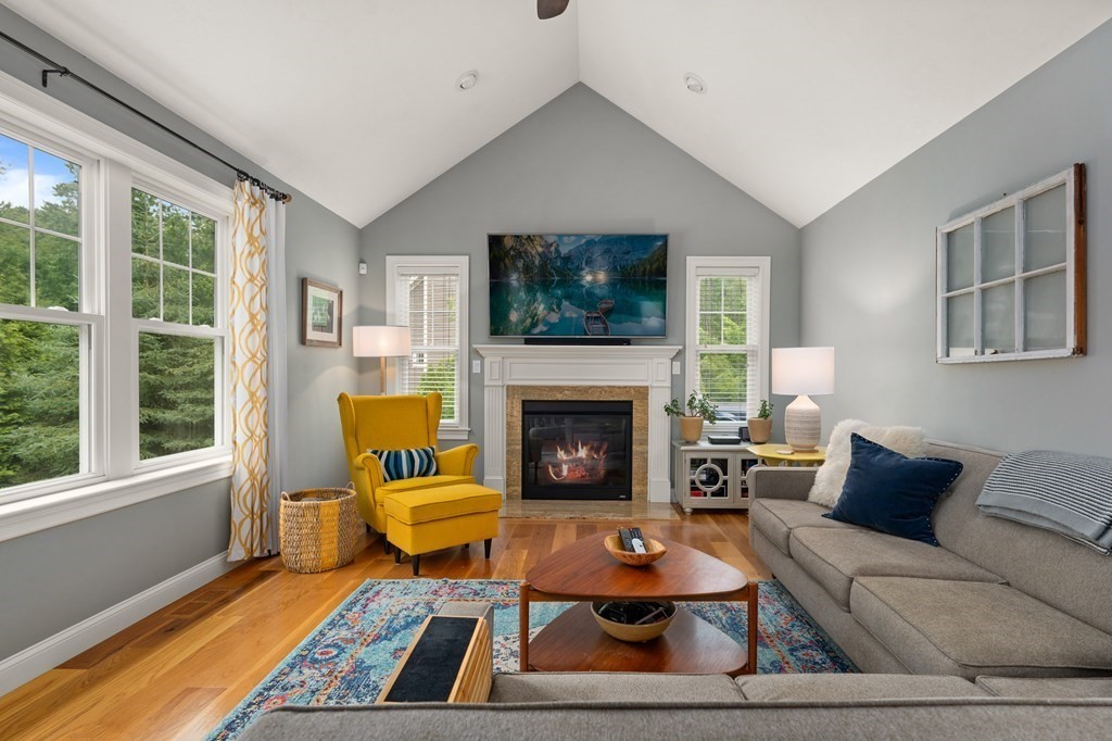 4 Mentas Circle Woburn, MA 01801 - Photo 9 of 41 a living room with furniture and a fireplace
