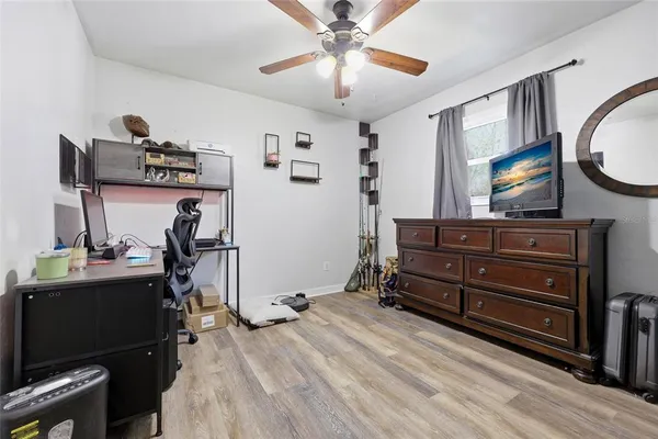 a bedroom with a bed and furniture
