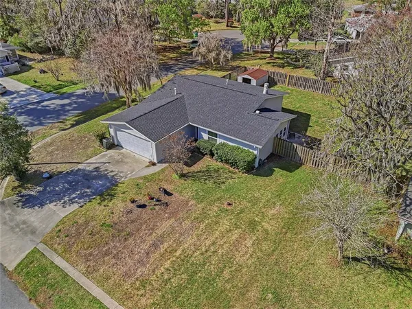 a aerial view of a house with a yard