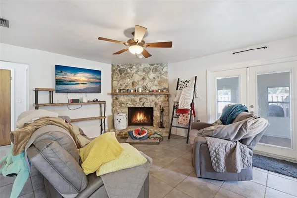 a living room with furniture and a fireplace