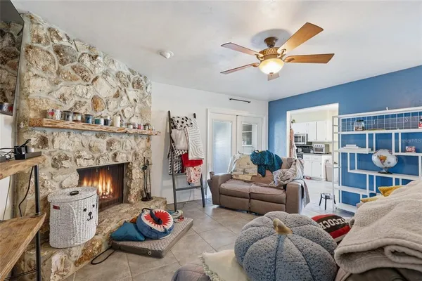 a living room with furniture and a fireplace