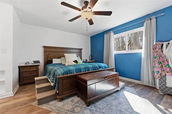 a bedroom with a bed and a window