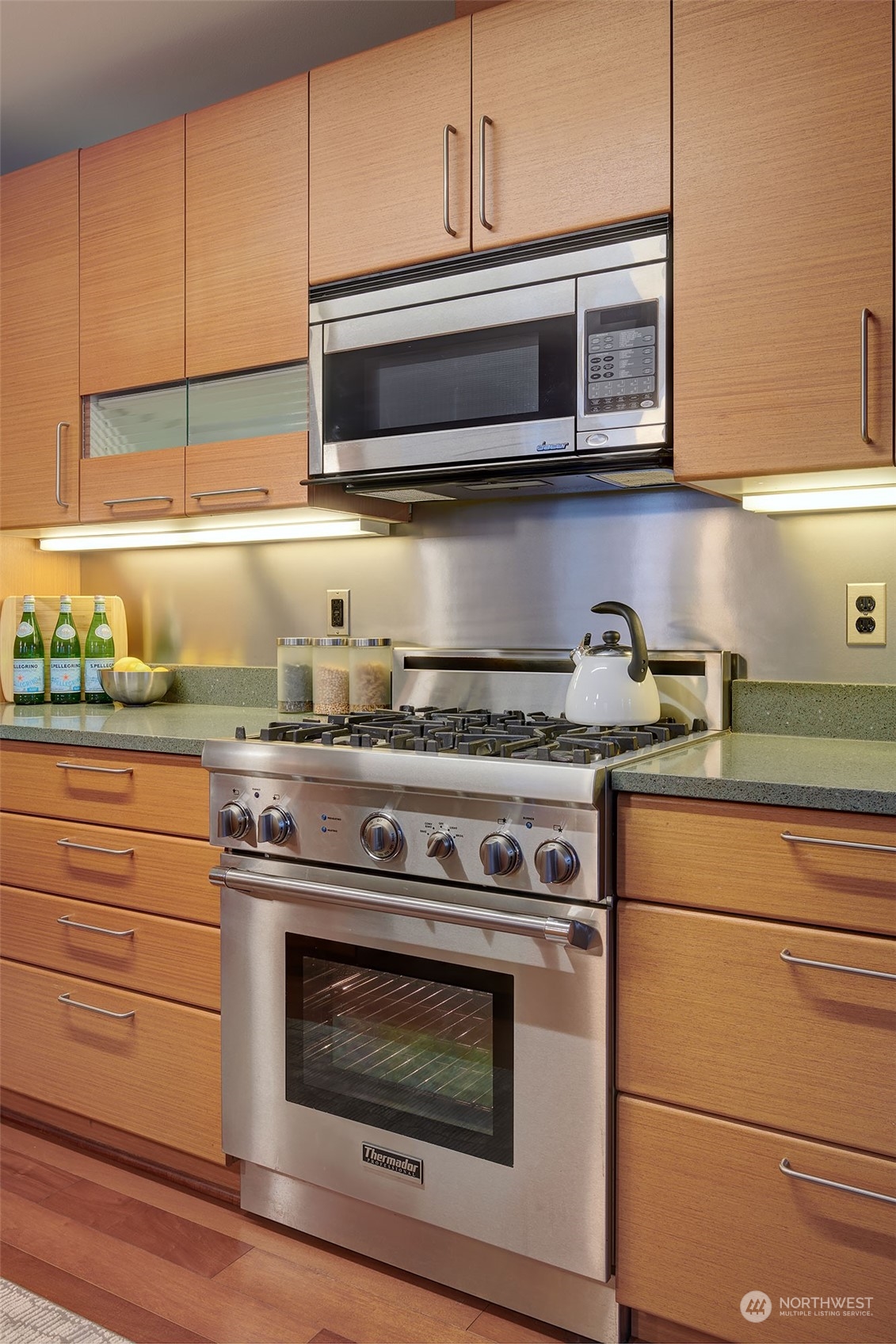1530 Northwest Market Street, Unit 812 Seattle, WA 98107 - Photo 11 of 34 a stove top oven sitting inside of a kitchen