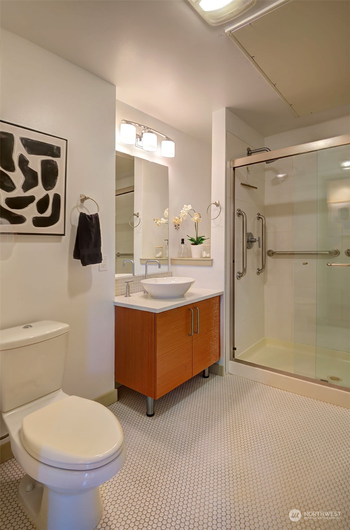 1530 Northwest Market Street, Unit 812 Seattle, WA 98107 - Photo 17 of 34 a bathroom with a toilet sink shower and mirror