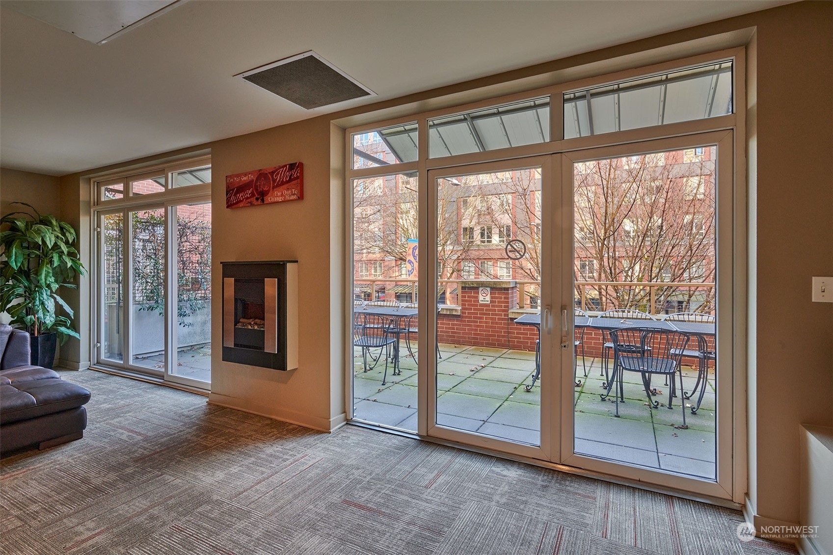 1530 Northwest Market Street, Unit 812 Seattle, WA 98107 - Photo 22 of 34 an empty room with floor to ceiling windows and an outdoor view