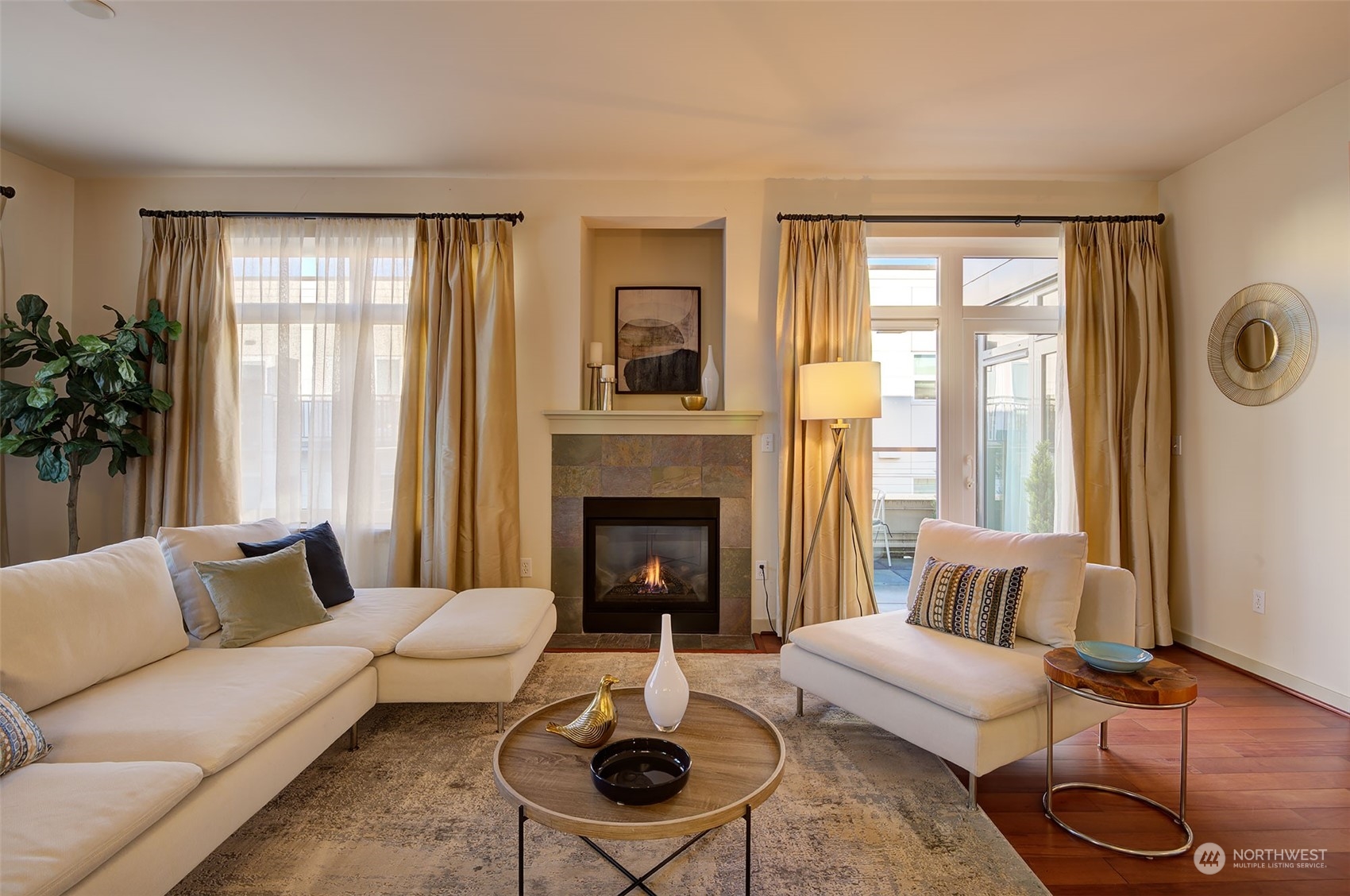 1530 Northwest Market Street, Unit 812 Seattle, WA 98107 - Photo 3 of 34 a living room with furniture and a fireplace