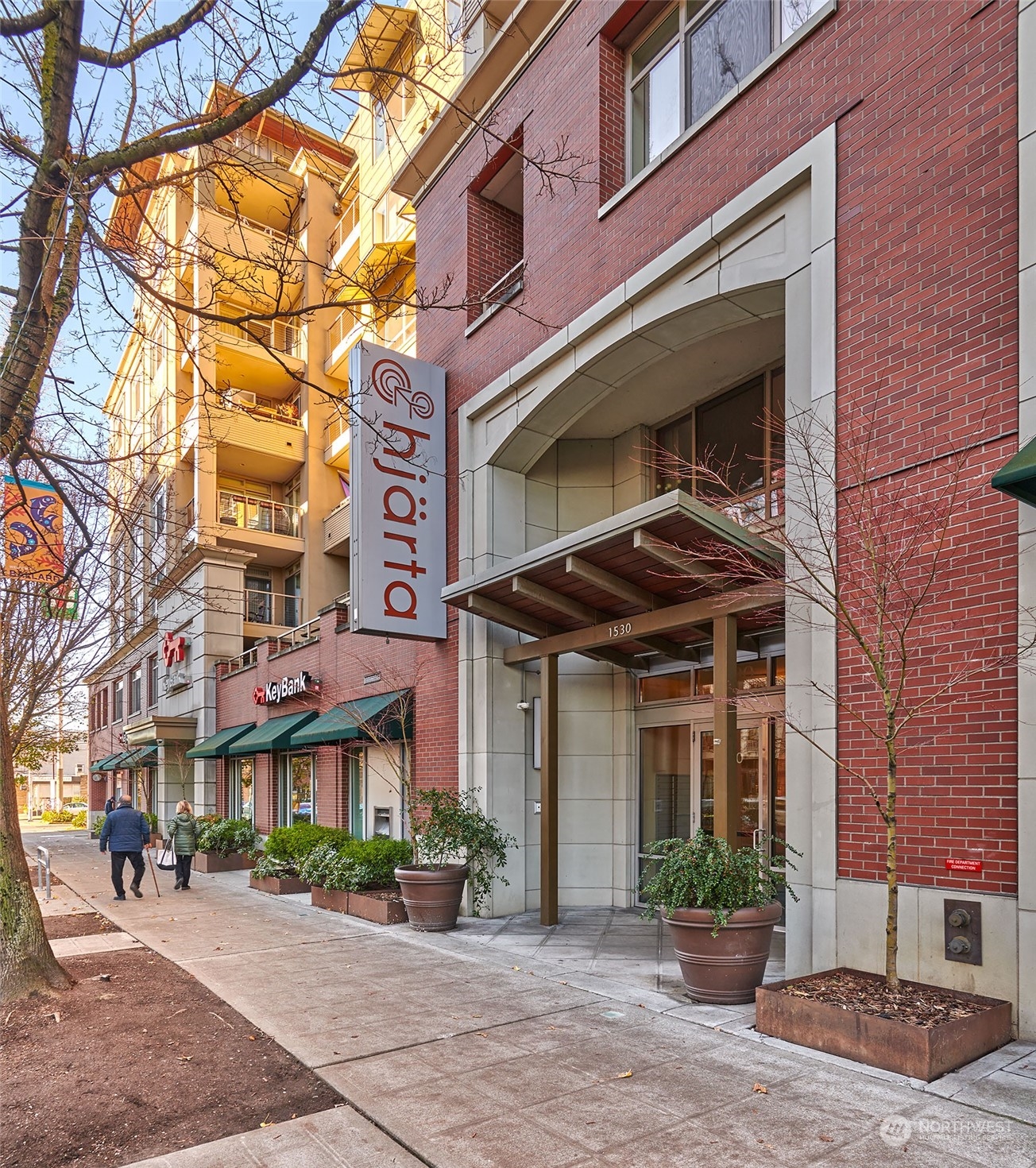 1530 Northwest Market Street, Unit 812 Seattle, WA 98107 - Photo 34 of 34 a front view of a building with a garden and plants