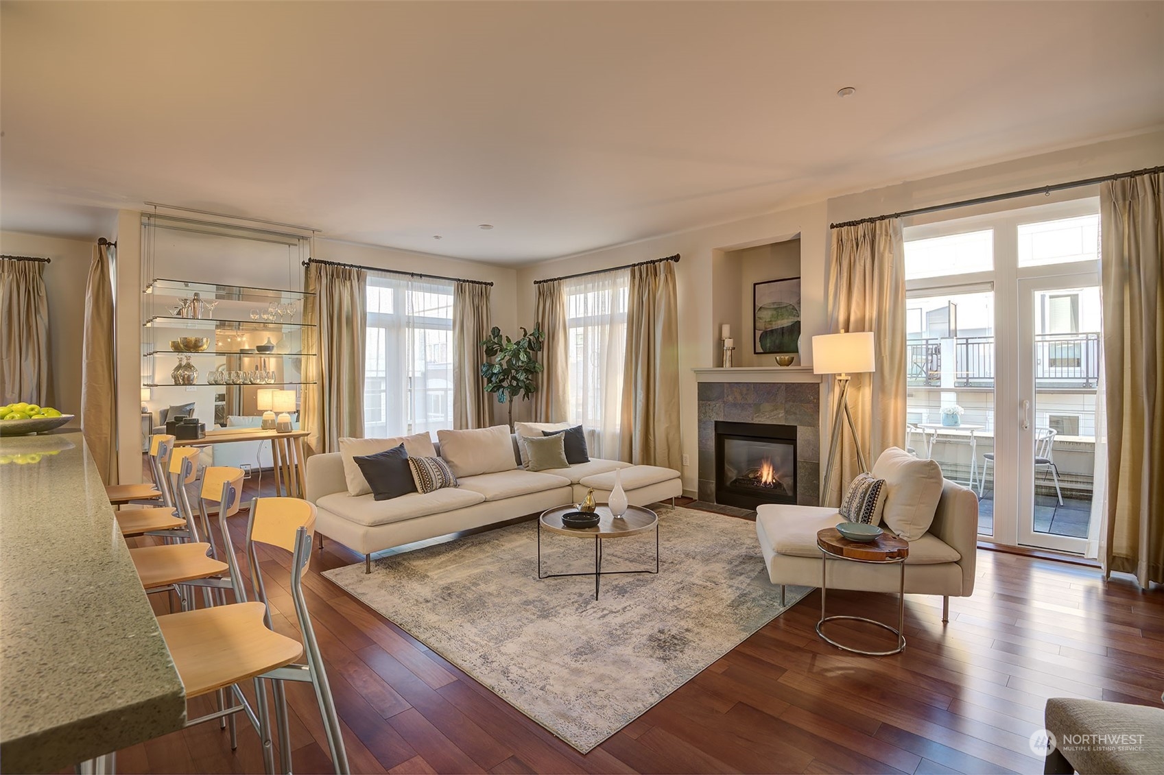 1530 Northwest Market Street, Unit 812 Seattle, WA 98107 - Photo 7 of 34 a living room with fireplace furniture and a large window