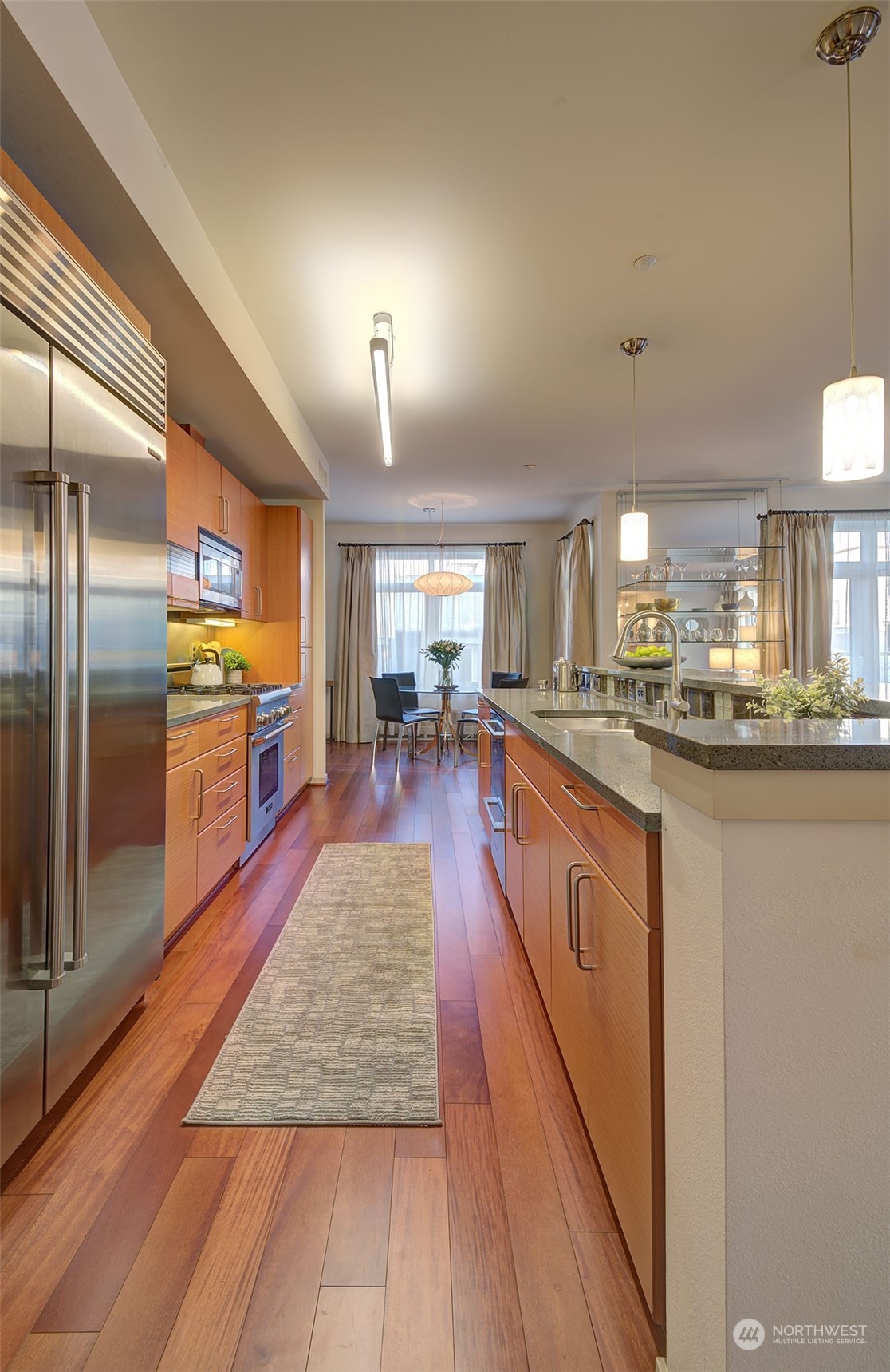 1530 Northwest Market Street, Unit 812 Seattle, WA 98107 - Photo 10 of 34 a large kitchen with kitchen island a large counter top