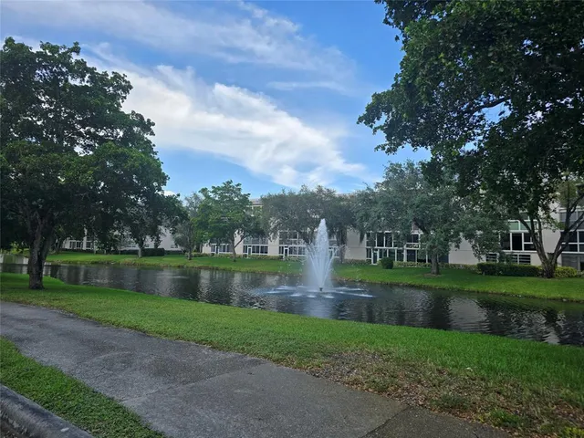a view of a lake with a house in the background